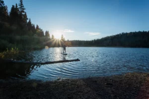 9 ways to Deepen Your Relationship with Nature Paddle Boarding on a gorgous alpine lake helps you connect with the water, the land, and yourself
