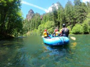 Participants exploring Oregon’s wild landscapes on a 5-day journey featuring rafting, camping, and legal psilocybin facilitation, set against the dramatic backdrop of Crater Lake and deep Pacific Northwest forests.